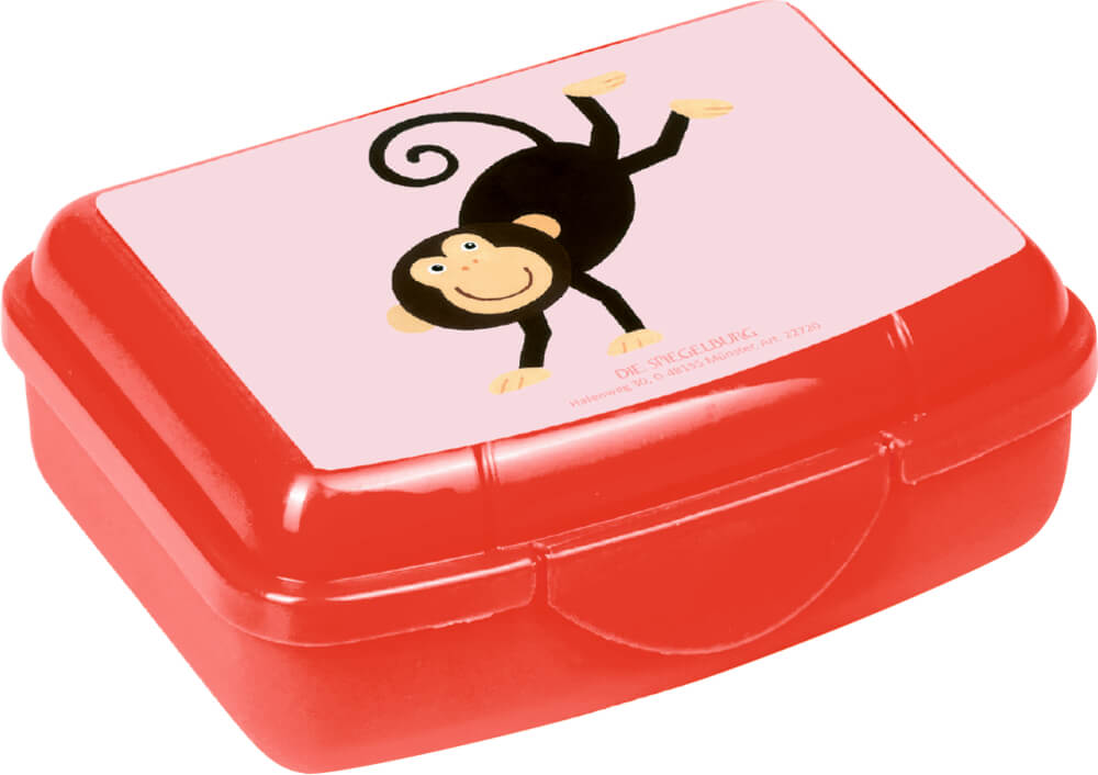 Mini snackbox vermelha da Die Spiegelburg com ilustração de um macaco, ideal para lanches de bebé.