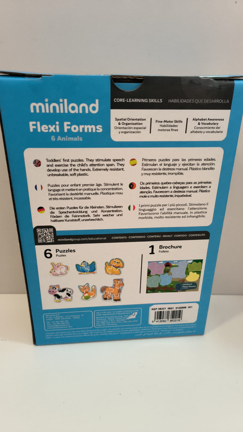 Verso da embalagem do puzzle Miniland Flexi Forms Animais, detalhando as competências centrais (orientação espacial, motricidade fina) e o conteúdo (6 puzzles e 1 folheto).