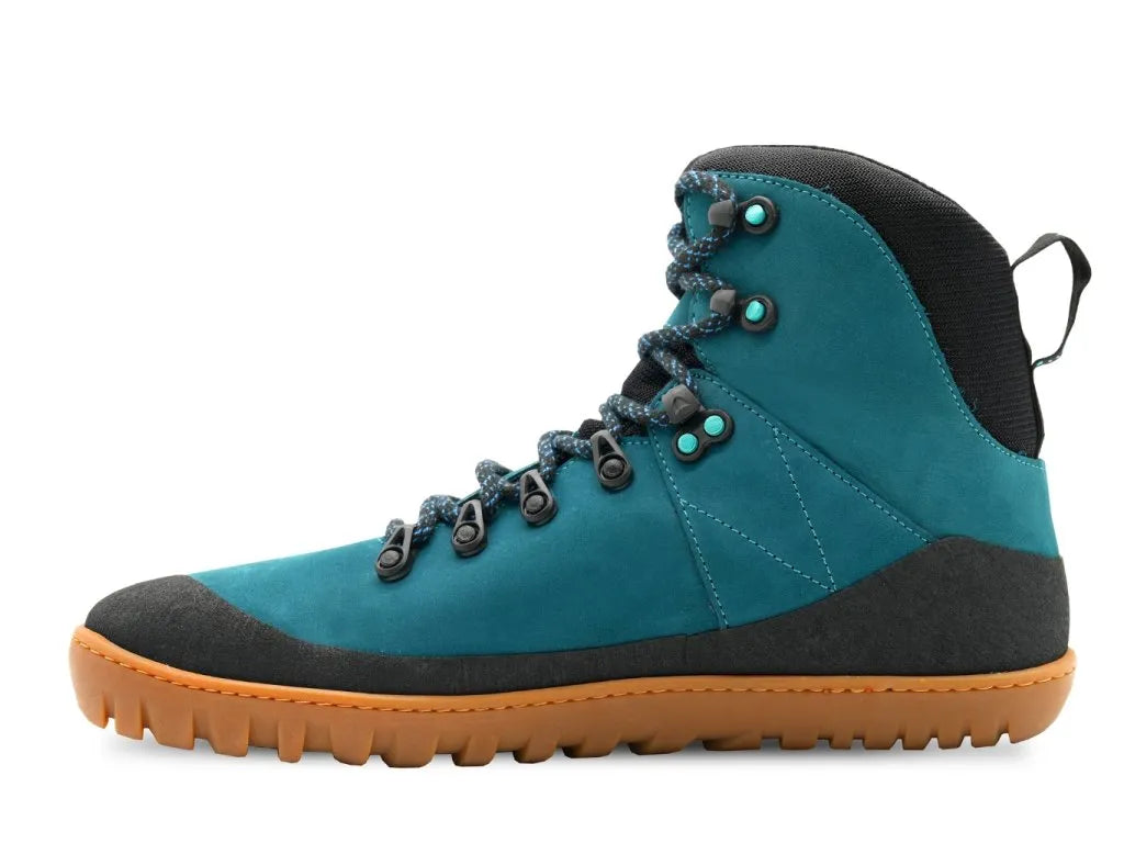 Perfil das botas MITU azul petróleo, destacando o design ergonómico e a biqueira reforçada.

