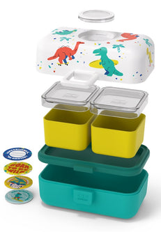 Lancheira Monbento Tresor Dinossauros explodida, mostrando os 3 compartimentos internos amarelos, as tampas herméticas e os autocolantes para personalização.