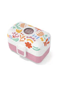 Lancheira Monbento Tresor grande com padrão floral "Paper Cut" em tons pastel, base rosa e fecho branco.