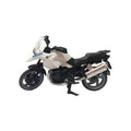 Miniatura de uma moto de polícia SIKU, predominantemente branca e preta, com a inscrição "POLICE" no para-brisas, representando um modelo de intervenção da Catalunha.