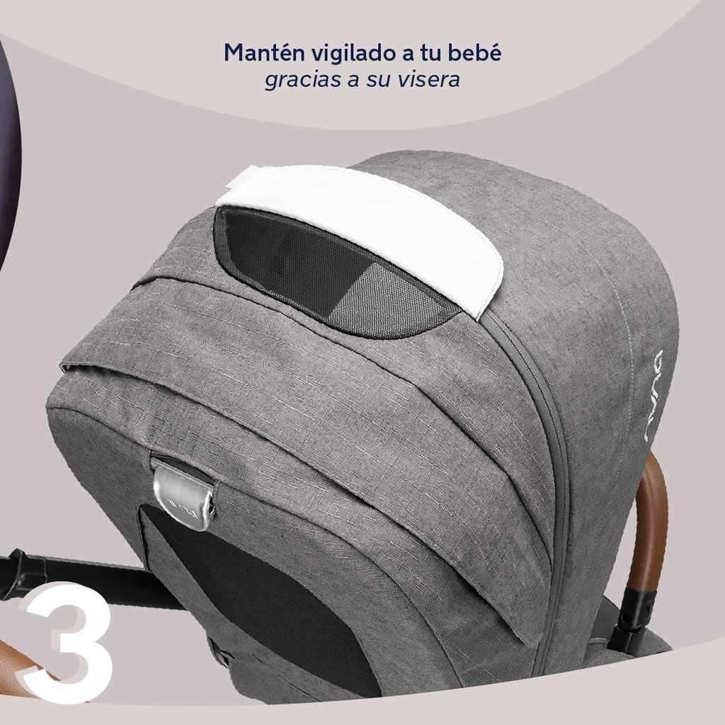 Detalhe da capota extensível do carrinho Nuna MIXX NEXT em tecido cinzento, com viseira e painel de ventilação para manter o bebé vigiado.