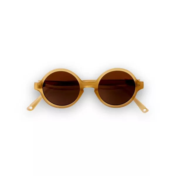 Óculos de sol redondos Woam da Kietla, cor castanha clara, com lentes escuras, apresentados isoladamente sobre fundo branco.