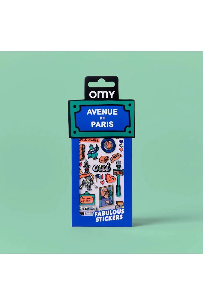 Embalagem dos autocolantes OMY "Avenue de Paris" com tema parisiense, destacando o logótipo OMY e vários vinis coloridos como a Torre Eiffel.