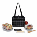 Packit Bolsa Lancheira Térmica Hampton em Black Grid, fechada, mostrando o design elegante e a alça de transporte.