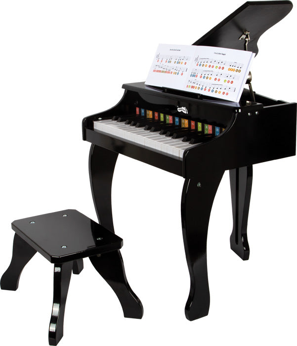 Detalhe do piano small foot, mostrando as teclas com letras coloridas e a marca small foot.