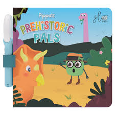 Capa do livro interativo "Pippa's Prehistoric Pals" da Glo Pals, mostrando um triceratops e uma personagem verde, com a lupa mágica acoplada.