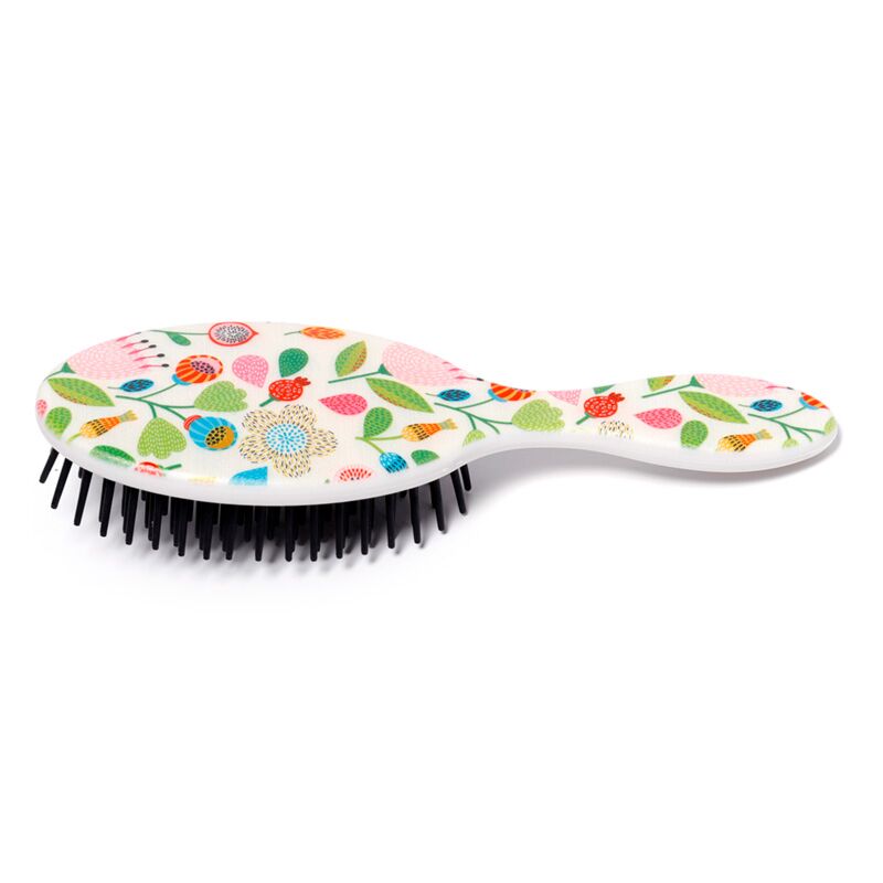 Escova de cabelo ergonómica Puckator com padrão floral colorido sobre fundo branco, mostrando cerdas pretas flexíveis.