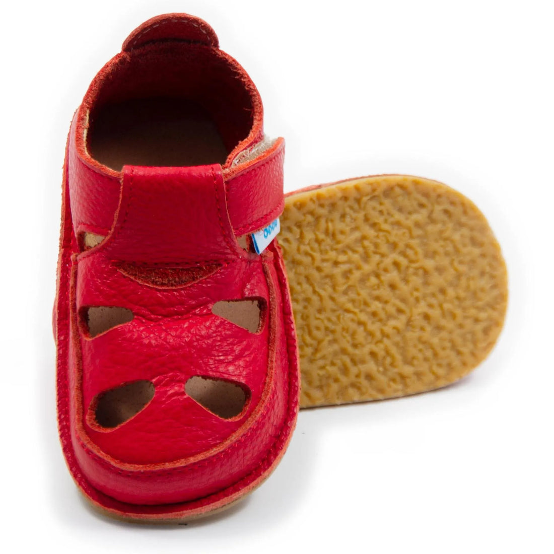 Sandálias barefoot Dodo Shoes em vermelho, com design anatómico e sola de borracha natural flexível de 3 mm, oferecendo excelente aderência e conforto para o desenvolvimento saudável dos pés infantis.