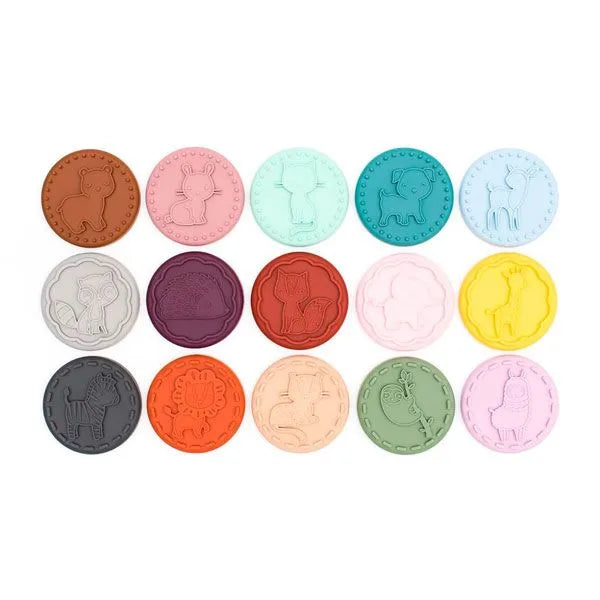 Vista superior dos 15 carimbos de bolachas Monneka em silicone, exibindo os diferentes designs de animais detalhados.