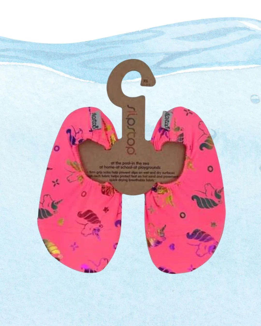 Par de meias antiderrapantes Slip Stop modelo LIZ, cor rosa choque com padrão de unicórnios holográficos, apresentadas em cartão de pendurar.