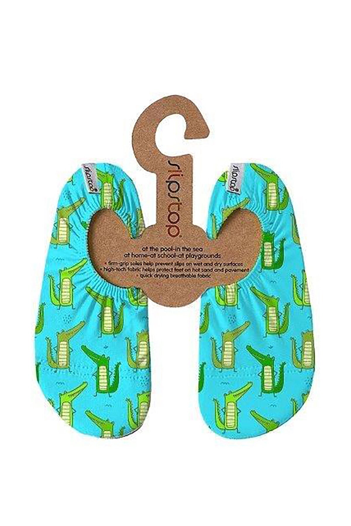 Par de meias antiderrapantes Slip Stop "Lizard" azuis com padrão de crocodilos verdes, presas num suporte de cartão reciclado.