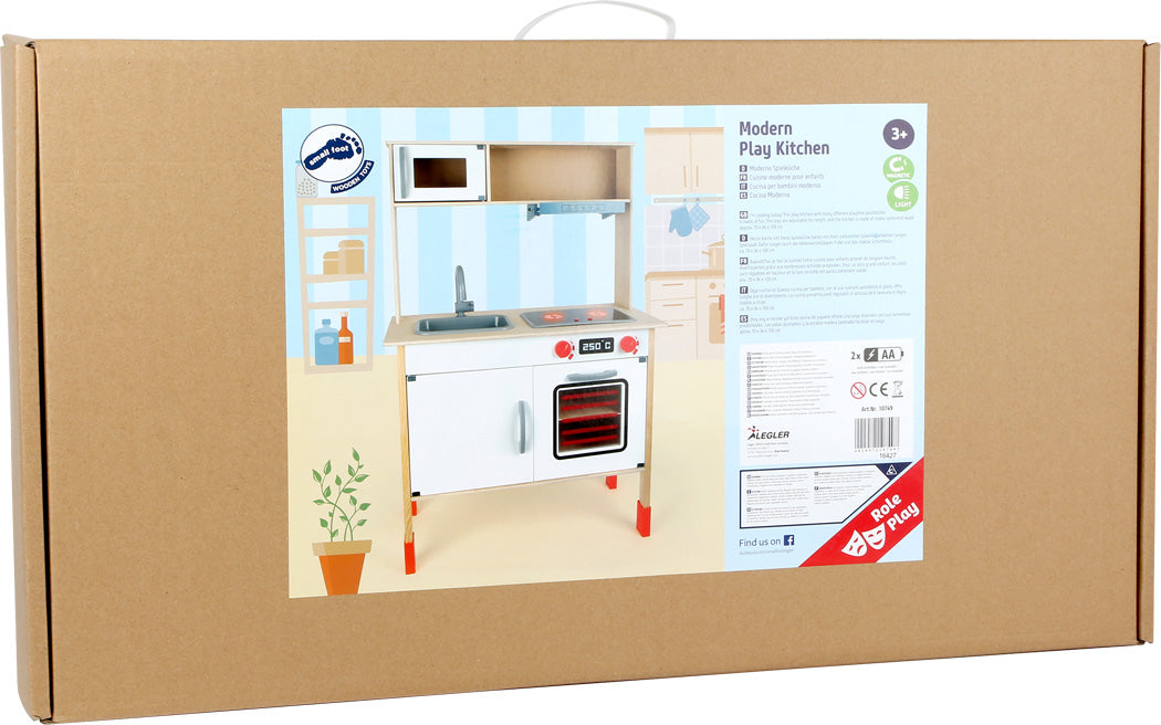 Embalagem de cartão da cozinha de brincar "Modern Play Kitchen" da small foot, mostrando o produto e informações de idade (3+).