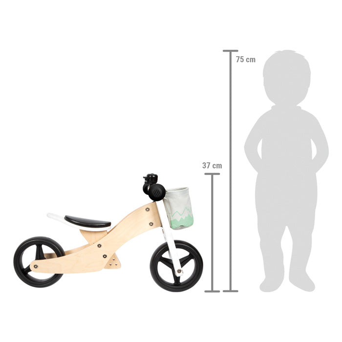 Comparação de escala do triciclo de treino Small Foot com a silhueta de uma criança, mostrando alturas de 37 cm e 75 cm.