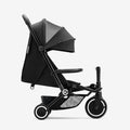 SMARTRIKE Traveler carrinho compacto preto em modo passeio, com capota solar e cesto de arrumação visível.