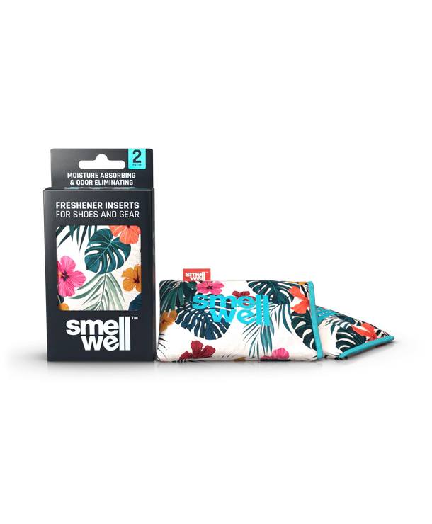 Embalagem e dois sacos SmellWell Active com padrão tropical floral (rosa, verde, laranja) para absorção de humidade e odores.
