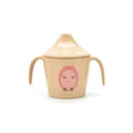 Taça de transição em fibra de arroz bege da Husk's Baby com tampa e pegas, apresentando um desenho de um porco cor-de-rosa.