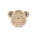 Prato infantil ecológico Husk's Baby em forma de macaco sorridente, de cor bege, feito de fibra de arroz, com divisórias para separar alimentos.
