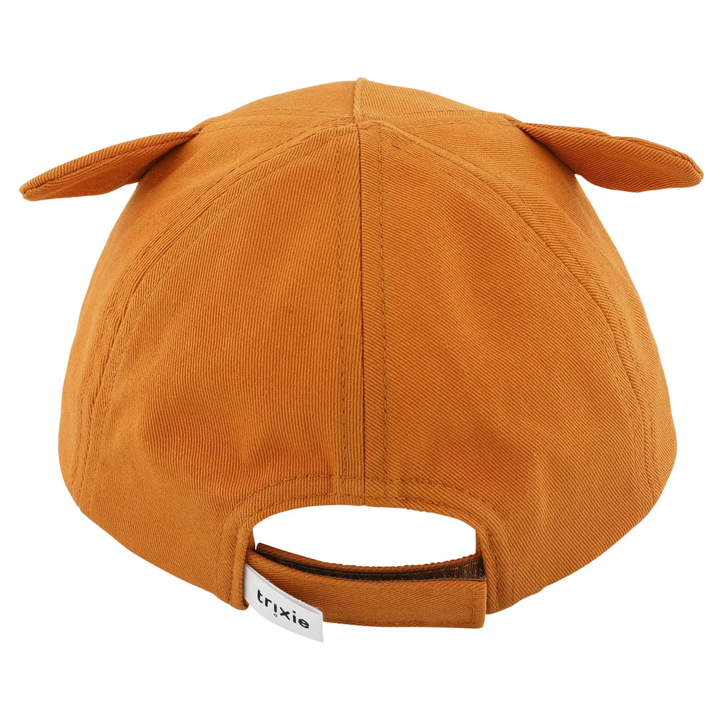 Vista traseira do boné Trixie raposa laranja, mostrando o fecho de velcro ajustável com etiqueta da marca Trixie.