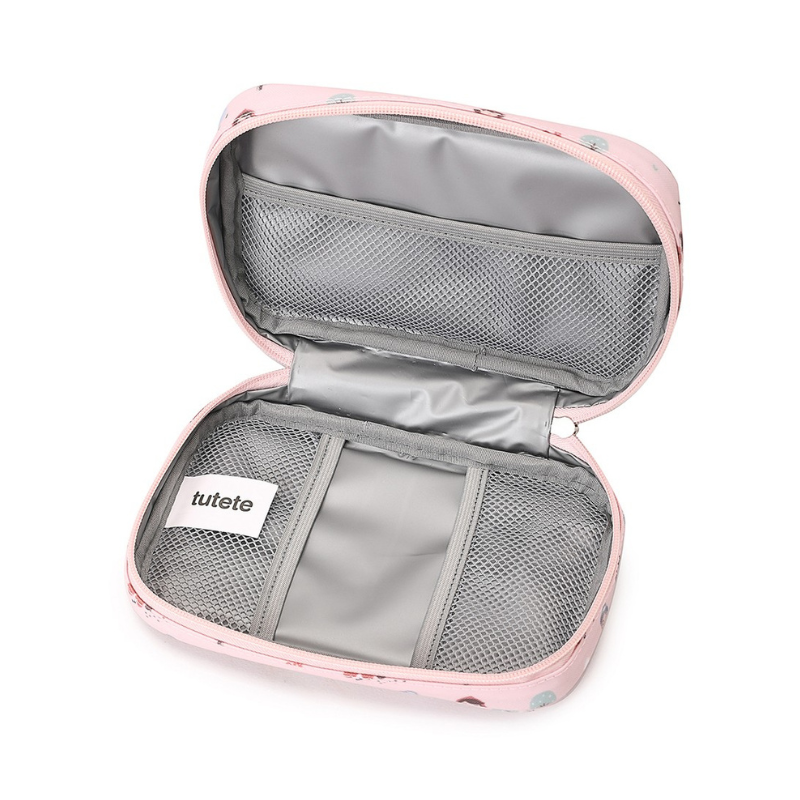 Interior da bolsa Tutete aberta, mostrando revestimento térmico cinzento, três bolsos de rede e etiqueta da marca.