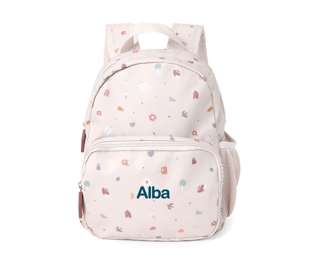 Mochila infantil Tutete bege com padrão pastel, personalizada com o nome "Alba" em azul escuro na parte frontal.