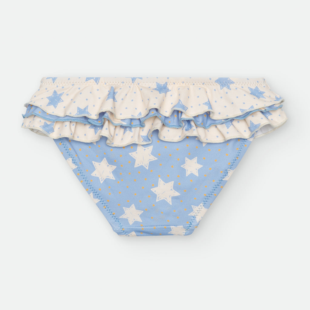 Vista traseira da cueca de banho Waterlemon com padrão de estrelas brancas em fundo azul claro e folhos na parte superior.
