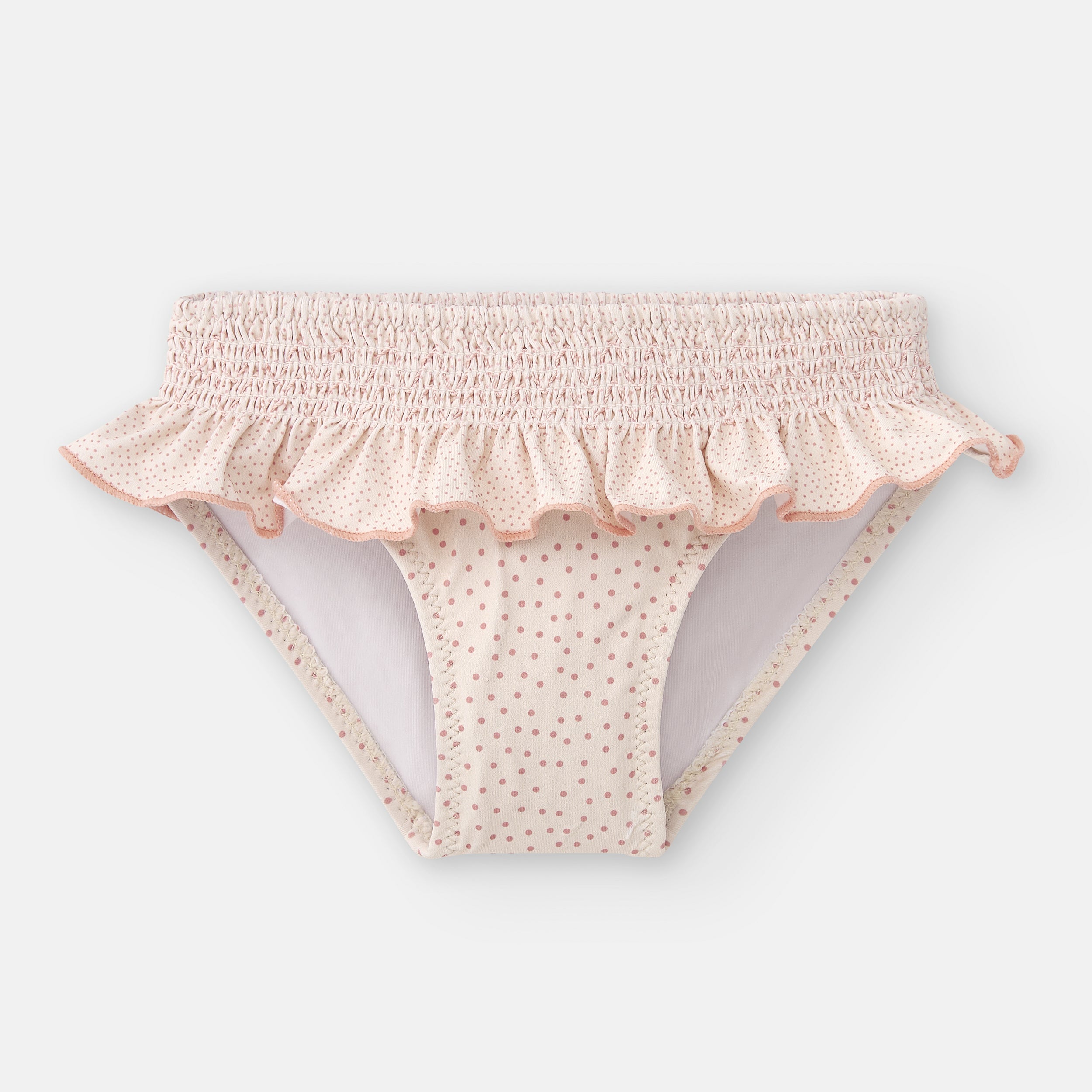 Vista frontal da cueca de praia Waterlemon para menina, em tecido rosa com bolinhas, destacando a cintura franzida e o folho decorativo.