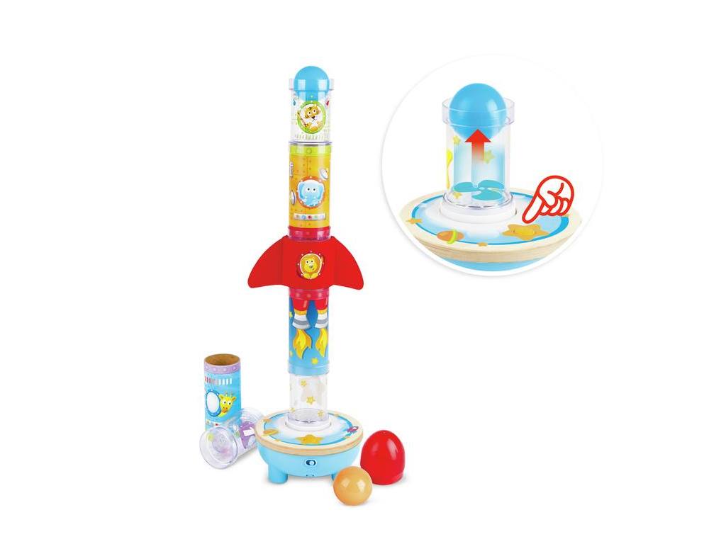 Imagem do Hape Foguetão com Bola ao lado de um diagrama que ilustra como a ventoinha na base impulsiona a bola para cima através dos tubos.