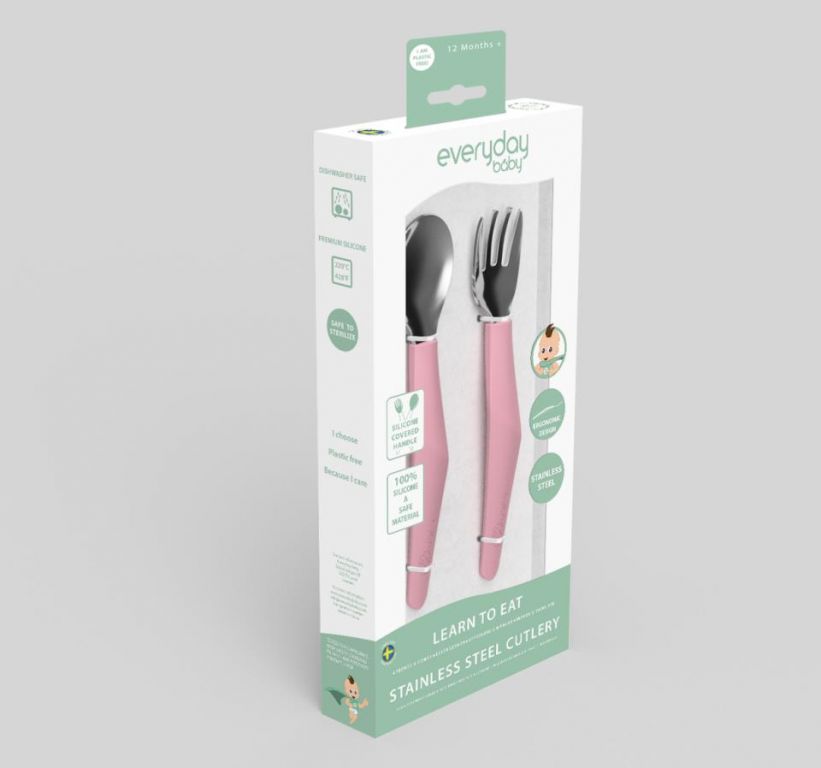 Embalagem de venda do conjunto de talheres Everyday Baby em cor rosa, destacando as características principais como silicone, aço inoxidável e indicação para +12 meses (Nota: A descrição indica +6 meses, mas a caixa mostra +12m - O texto deve focar-se nos 6m da descrição).