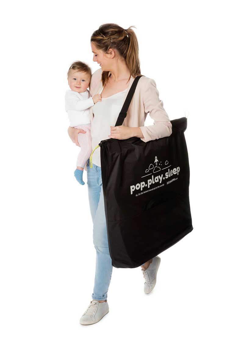 Detalhe do sistema de dobragem rápido da cama de viagem Aeromoov, ilustrando a montagem/desmontagem em dois segundos.