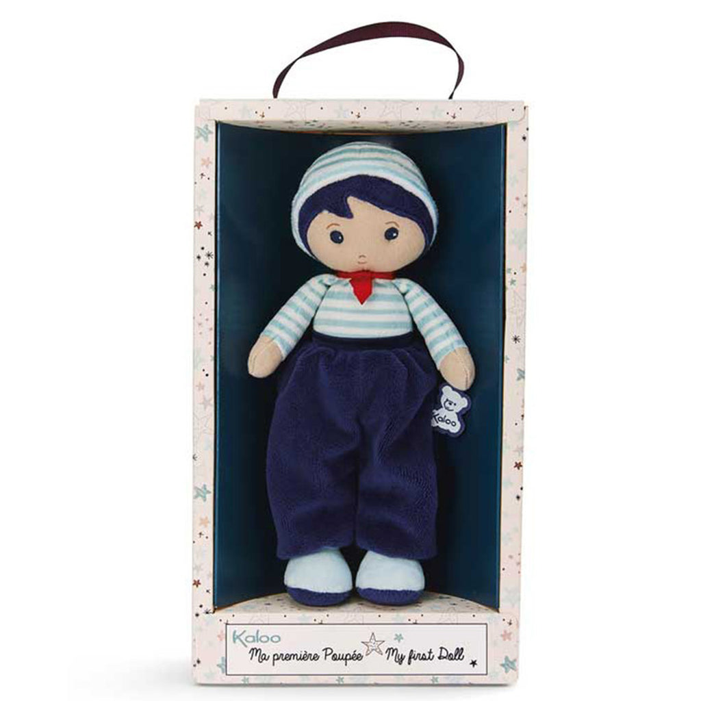 Boneco de pano Lucas da Kaloo dentro da sua caixa de oferta, vista frontal.