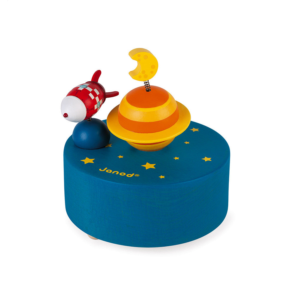 Caixa musical magnetica Janod com foguetinho a girar sobre planeta azul