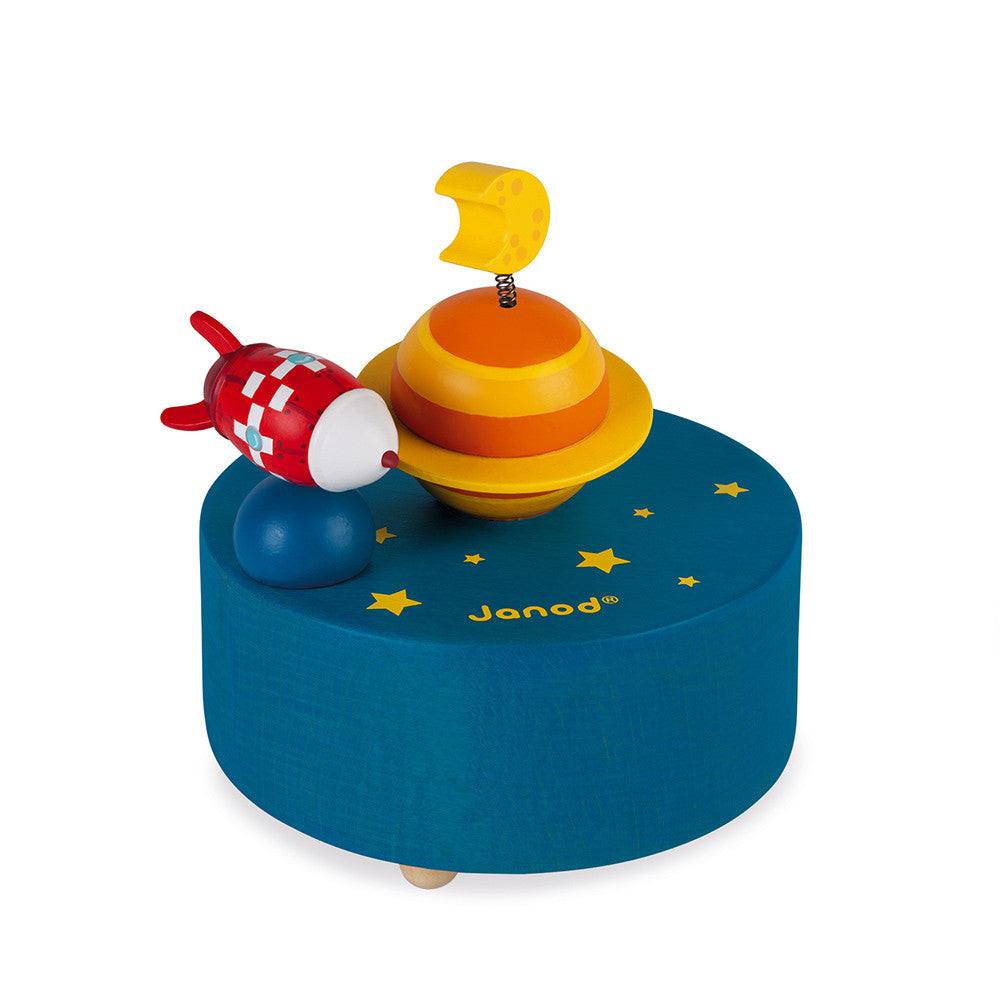 Caixa musical magnetica Janod com foguetinho a girar sobre planeta azul