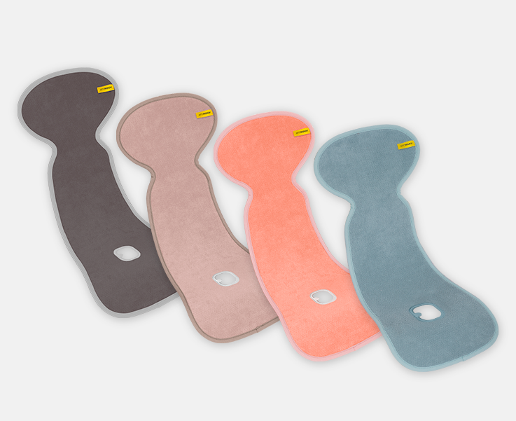 Quatro capas anti transpirantes Aeromoov AirLayer 3D em diferentes cores (castanho, rosa, coral e azul) sobrepostas.