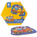 Caixa hexagonal amarela do puzzle Classic World com ilustração de camião de bombeiros e peça solta do puzzle.