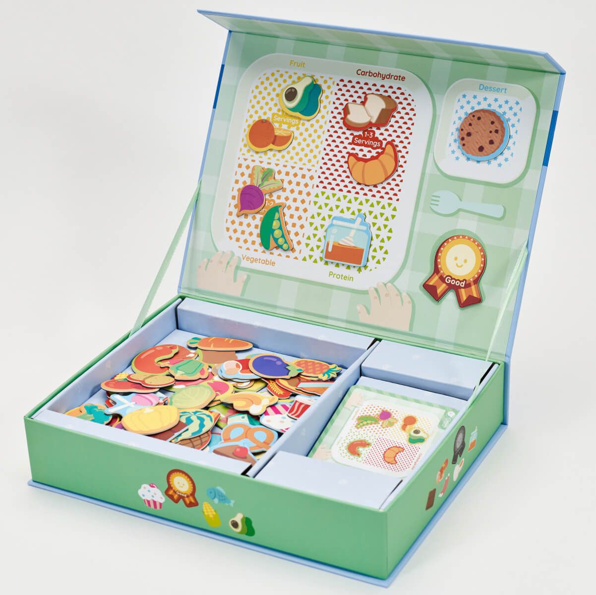 Visão geral do jogo Classic World Alimentação Saudável aberto, com peças magnéticas organizadas e guia alimentar.