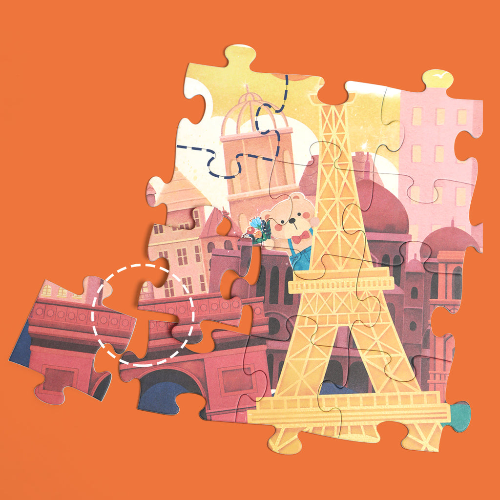 Criança a manusear uma peça do puzzle "Coco na França", ilustrando o desenvolvimento da coordenação olho-mão.