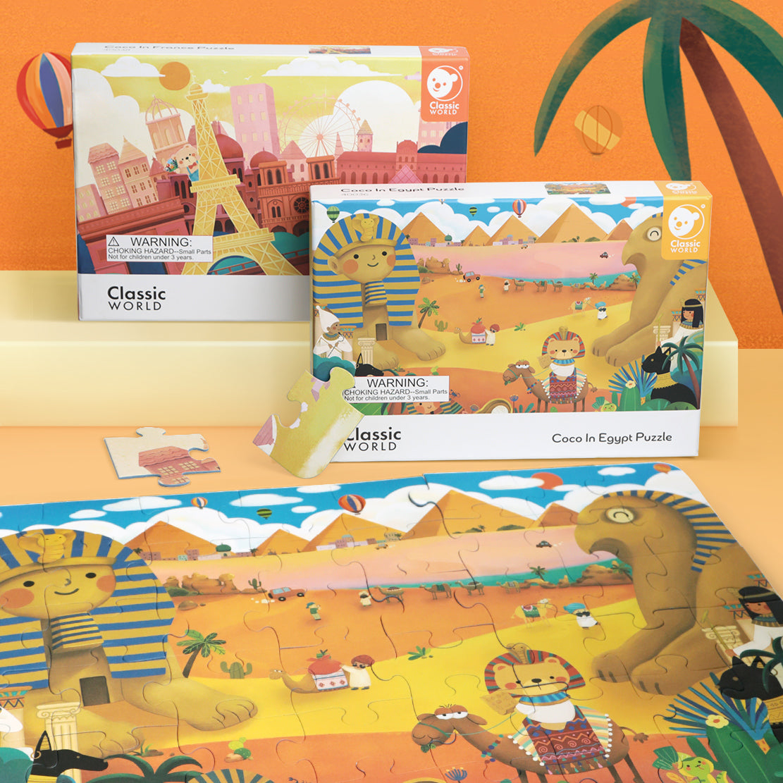 Detalhe da embalagem do puzzle "Coco no Egipto" da Classic World, com outros puzzles da coleção ao fundo.