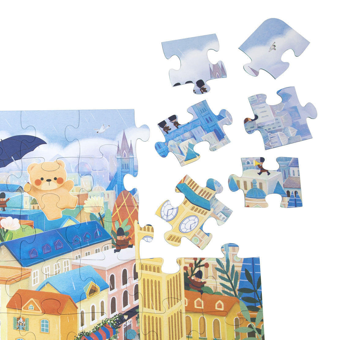 Detalhe de algumas peças do puzzle Classic World "Coco no Reino Unido", mostrando a ilustração de edifícios e personagens de Londres.