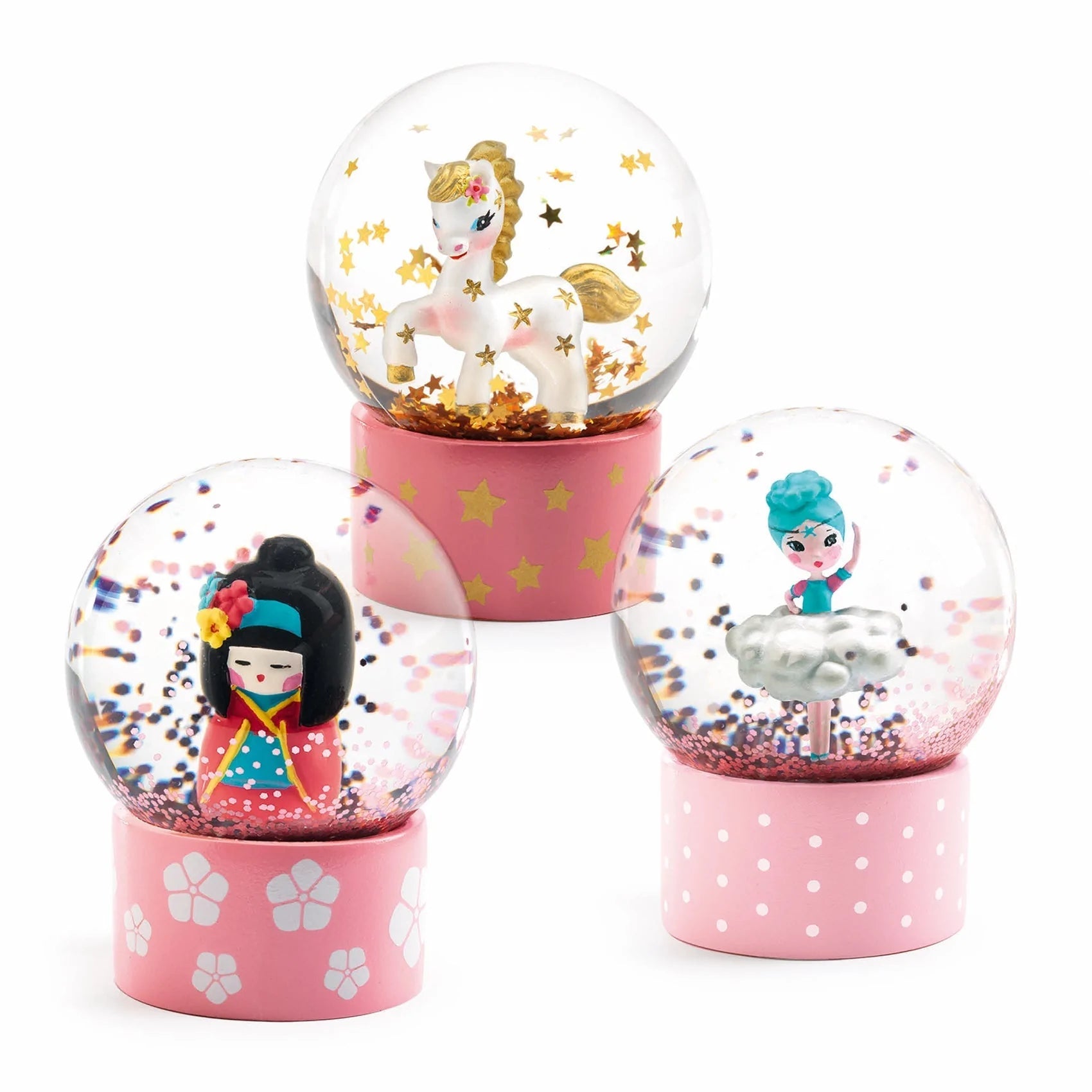 Conjunto de três mini globos de neve Djeco "Cute": unicórnio, Kokeshi e bailarina. Artigos colecionáveis com bases cor de rosa.