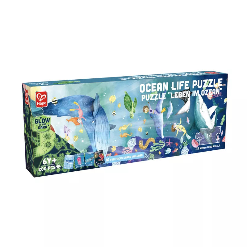 Puzzle Hape A Vida no Oceano de 150cm com 200 peças espalhadas sobre uma mesa.