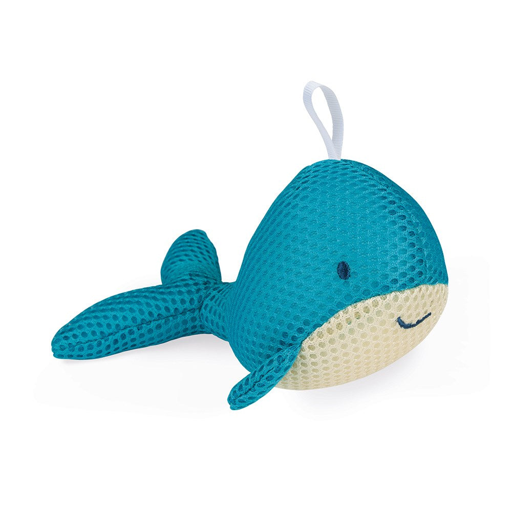 Esponja de banho Janod em forma de baleia azul com expressão sorridente.