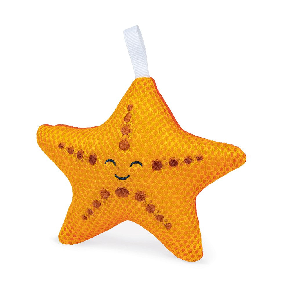 Esponja de banho Janod em forma de estrela do mar amarela com expressão sorridente.