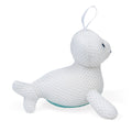 Esponja de banho Janod em forma de foca branca vista de lado.