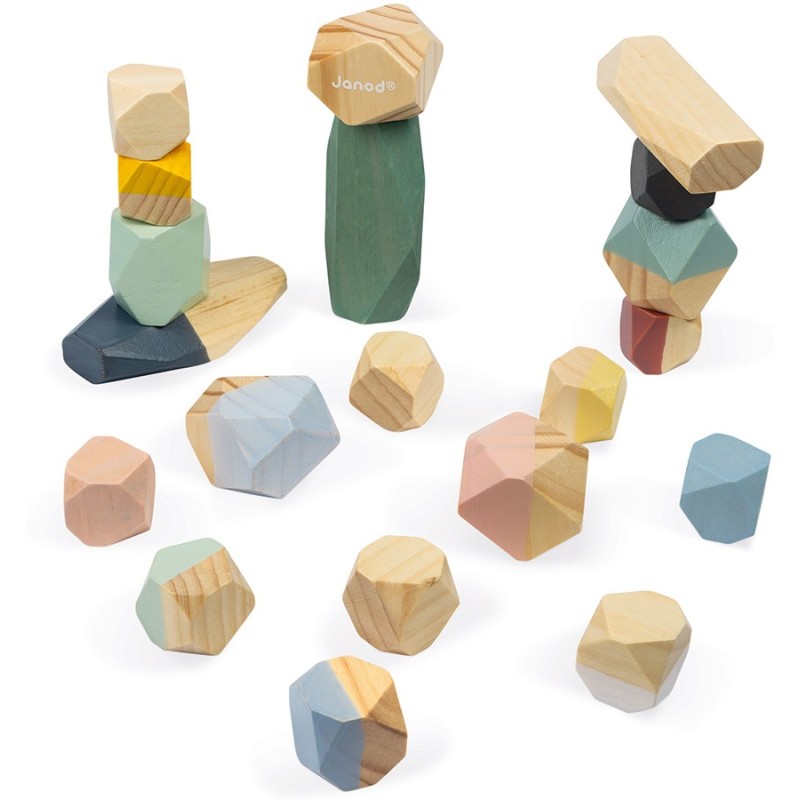 Conjunto de Janod Pedras para empilhar Sweet Cocoon, algumas empilhadas, outras espalhadas.