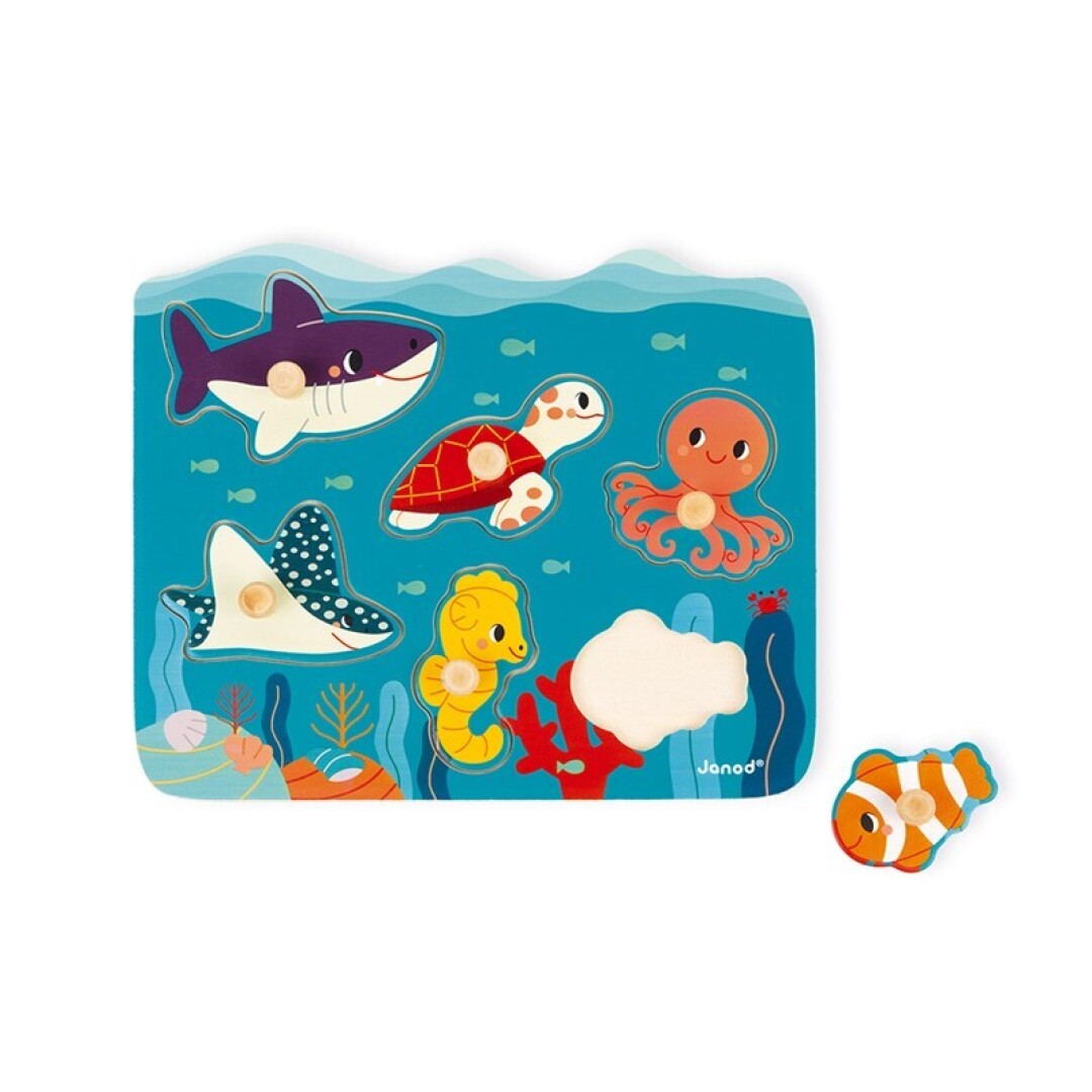 Puzzle de madeira Janod Oceano com 6 peças grandes de animais marinhos (tubarão, tartaruga, polvo, cavalo-marinho, arraia, peixe-palhaço) e saliências de encaixe.