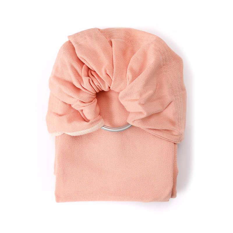 Sling de argolas rosa dobrado, mostrando os anéis de alumínio.