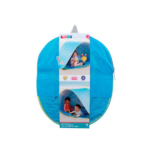 A tenda piscina Ludi Pop Up dobrada e compacta, guardada no seu saco de transporte cinzento.