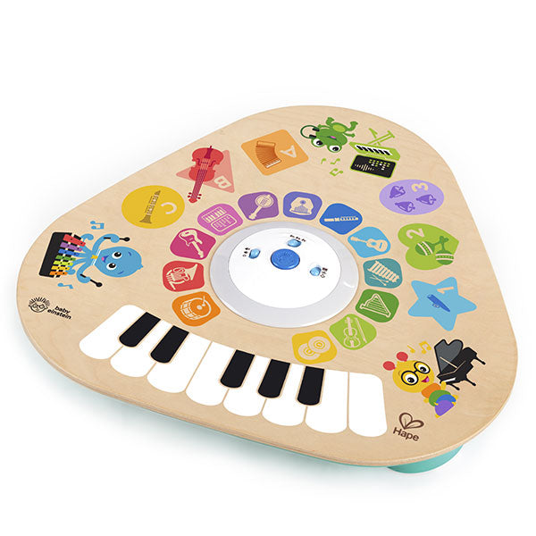 Vista de perto da superfície da Hape Baby Einstein Mesa de Atividades Magic Touch, mostrando o teclado e os ícones de instrumentos.